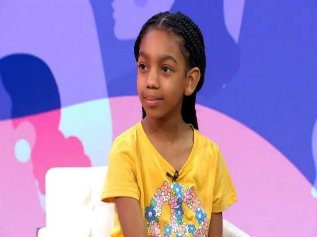 Paris smiling during a TV interview