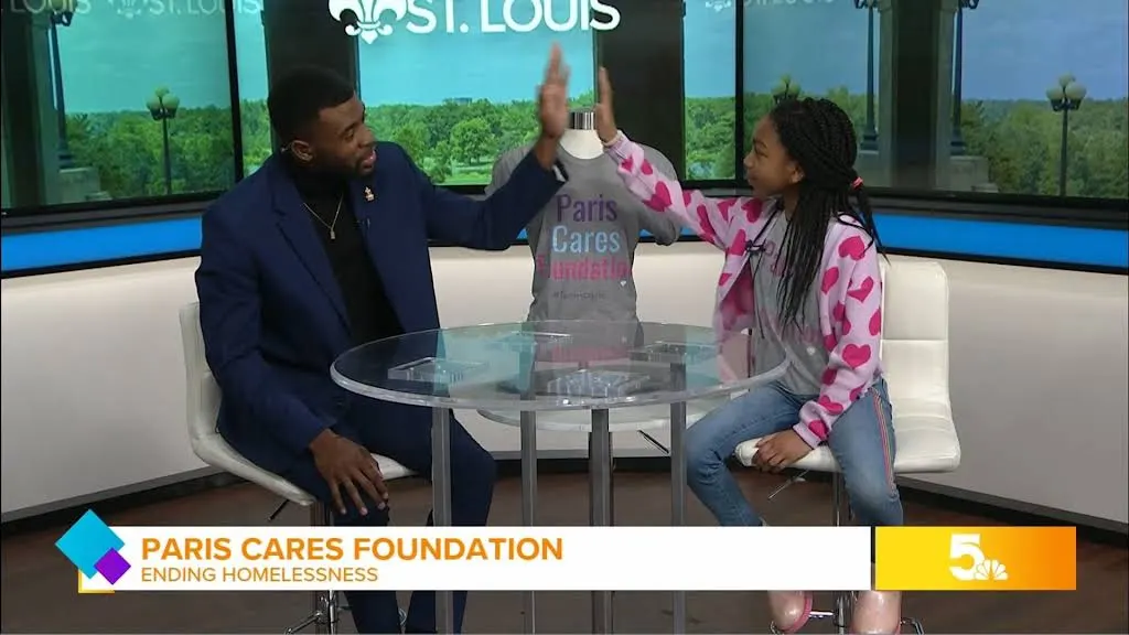 Paris high-fiving a KSDK host in the studio
